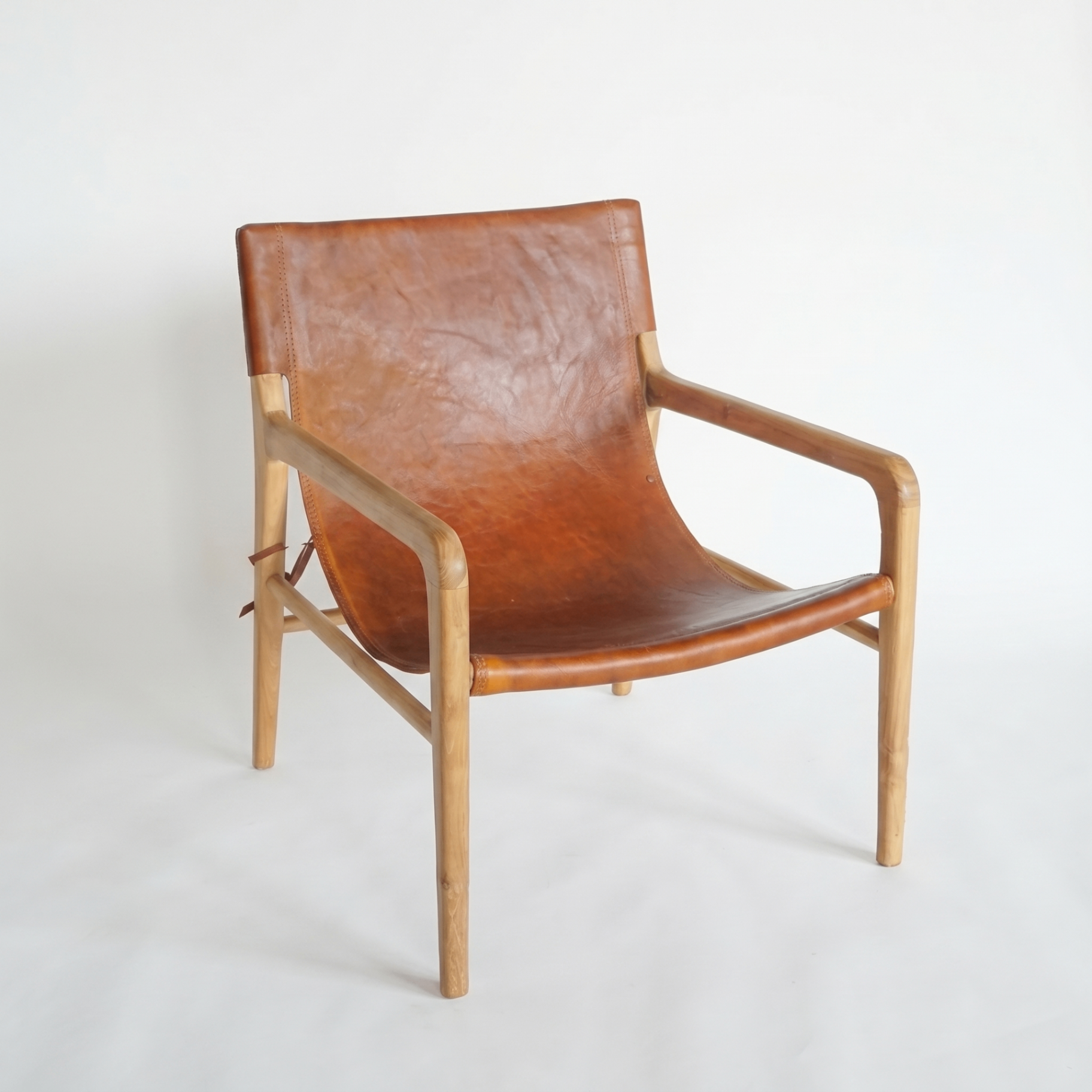 Bespoke teak and tan leather sling lounge chair