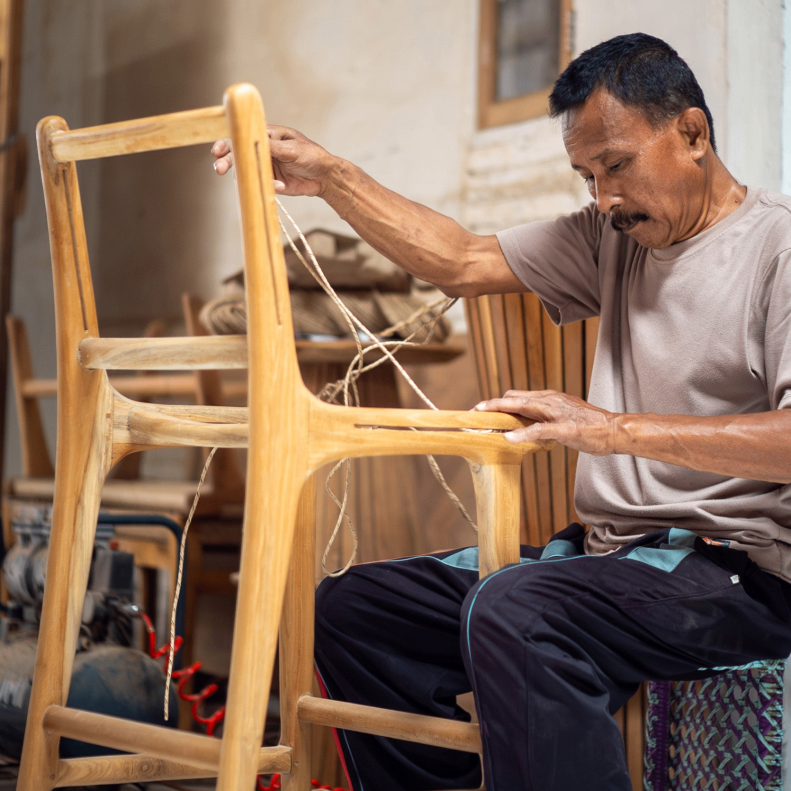 Craftsman assembling a chair frame